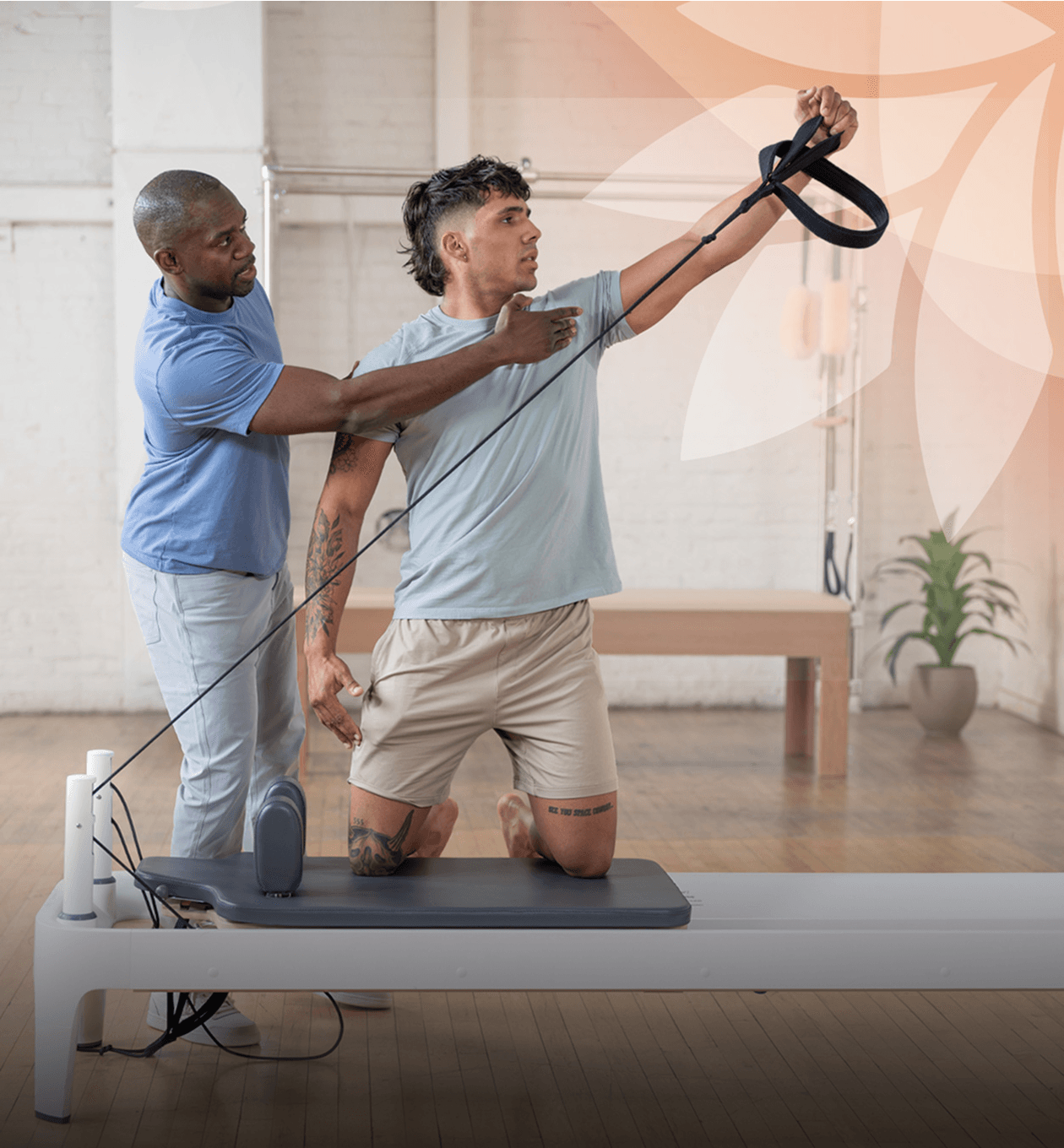 pt pro with client on a reformer